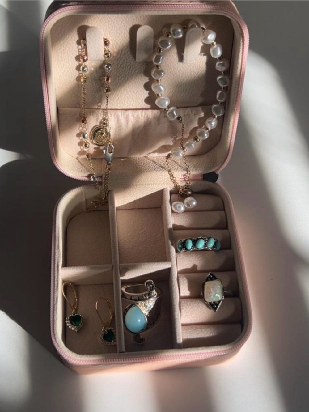 Portable Pink Jewelry Storage Case with Pearl and Gold Accents